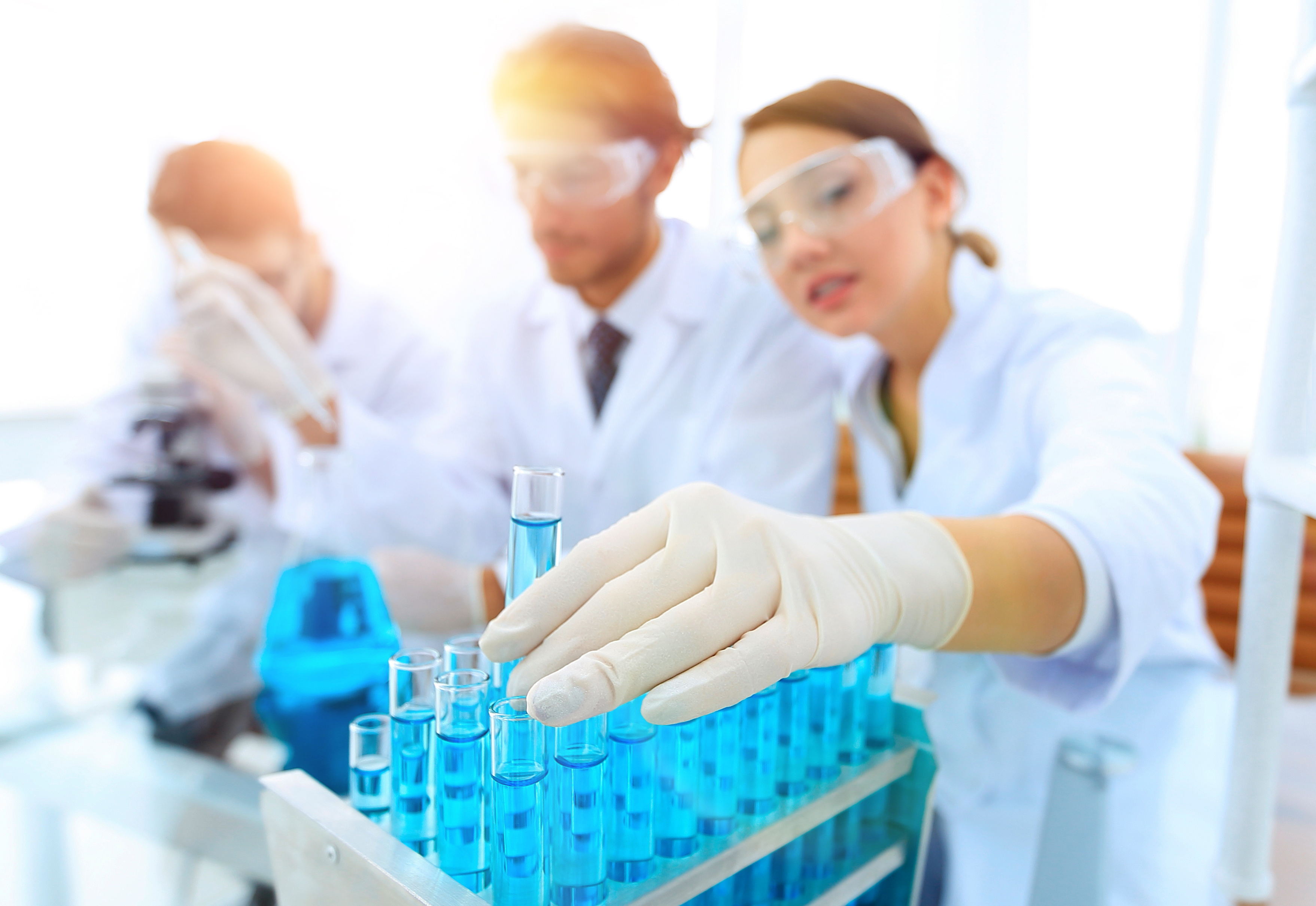 Scientist in a lab holding test tube