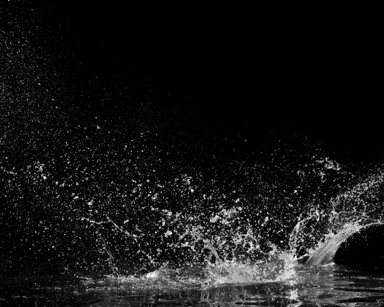 Picture of water splashing against a black background