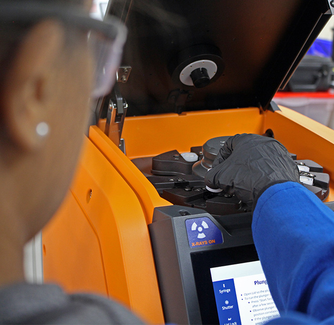 Sample being placed into analyzer